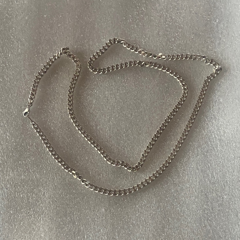 Curb link 40” necklace in silvertone metal.